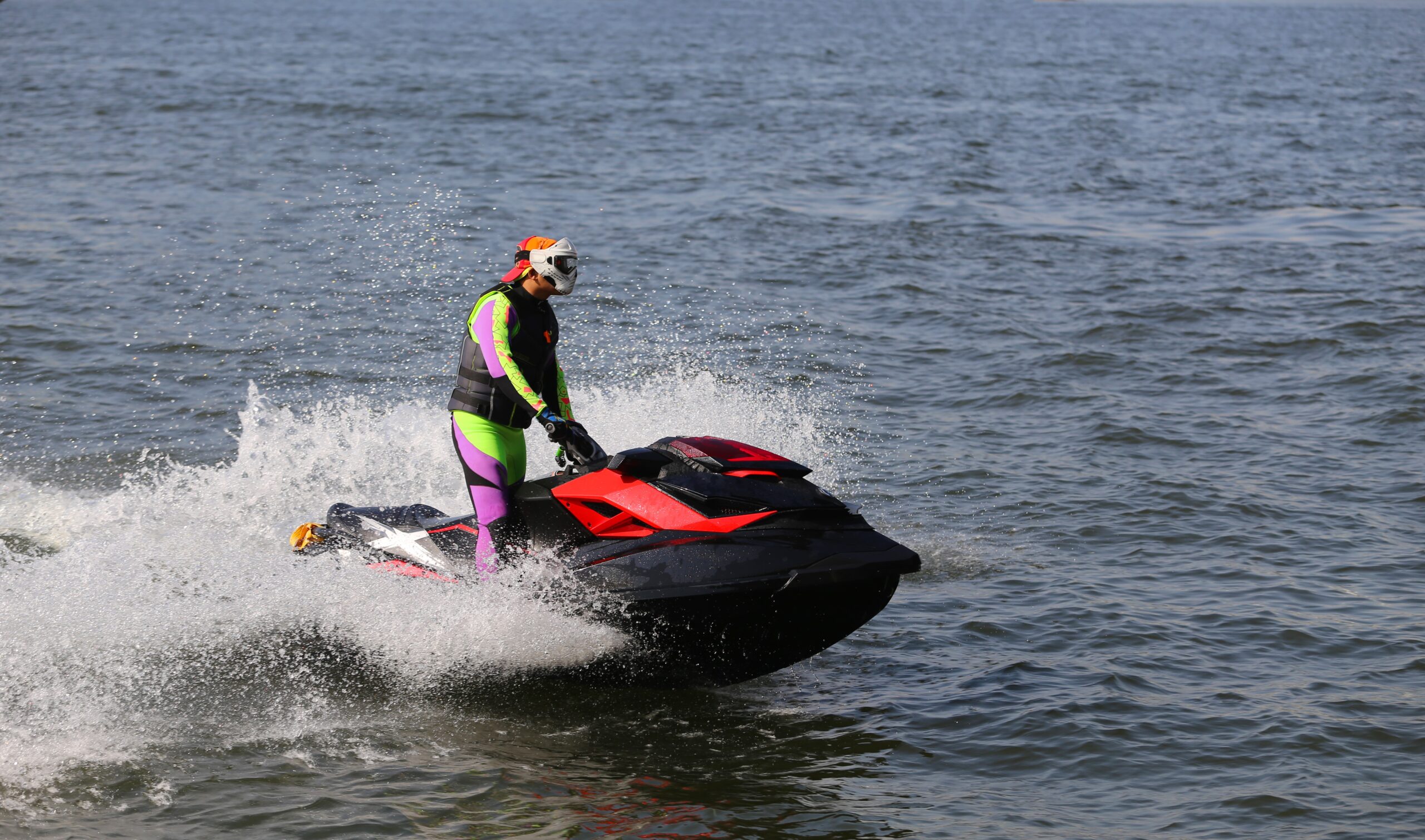 The young man quickly goes by water scooter